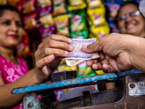 Money changing hands in an Indian shop.